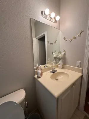 a bathroom with a sink and a mirror at The B Shared Resident in Miramar