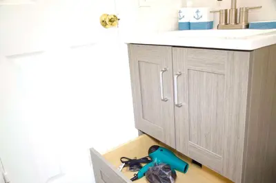 a bathroom with a sink and a bunch of tools in a drawer at Cozy3 Miami Beach Getaway Quick Walk to the Ocean in Miami Beach