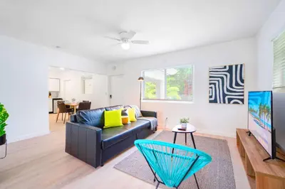 a living room with a couch and a table at Miami Studio a Few Steps to the Beach in Miami