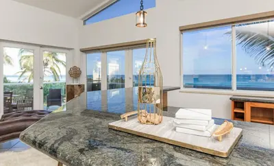 a kitchen with a table with a view of the ocean at Oceanfront Luxury Villa 5Bedroom and 4Bath Beach Access in Hollywood
