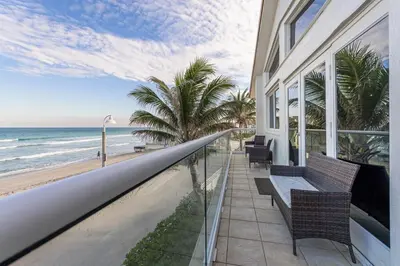 a balcony of a house with a view of the beach at Oceanfront Luxury Villa 5Bedroom and 4Bath Beach Access in Hollywood