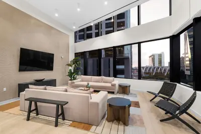a living room with a couch and a tv at Stylish Studio in Downtown Location in Miami