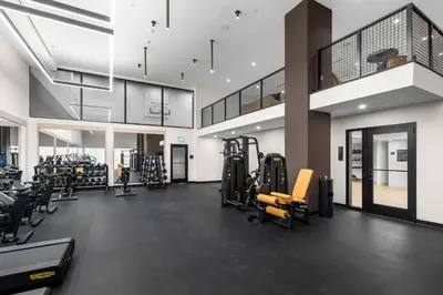a gym with treadmills and cardio equipment in a building at Stylish Studio in Downtown Location in Miami