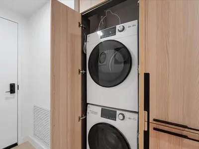 a washing machine and a dryer in a closet at Stylish Studio in Downtown Location in Miami