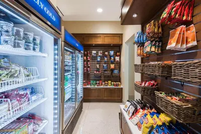 a store aisle of a grocery store with drinks and food at Homewood Suites by Hilton Miami Dolphin Mall in Miami
