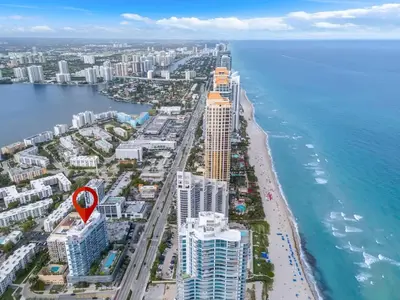 an aerial view of a beach with a red marker at Chic OceanView 2 Bedroom with Free Parking Pool Jacuzzi in Sunny Isles Beach