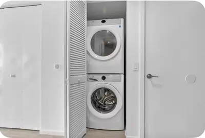 a washing machine and a washer and dryer in a room at Luxxe Suite Downtown Brickell in Miami