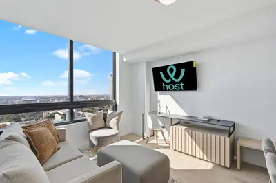 a living room with a couch and a piano at Well-Located Condo with Free Parking and Amenities in Miami