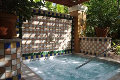 a swimming pool with a tile wall and a swimming cue at The Yacht Club at Aventura Miami 3405 in South Island