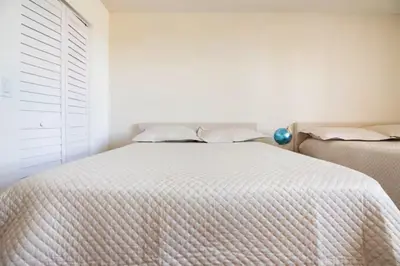a bedroom with two beds and a window at The Yacht Club at Aventura Miami 6307 in South Island