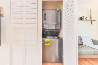 a small refrigerator in a room with white walls at Heart of Hollywood Villa in Hollywood