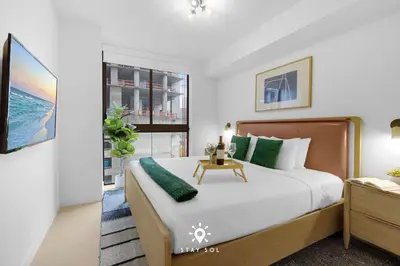 a bedroom with a large bed and a window at Stylish 1BR Apt With Pool in Miami