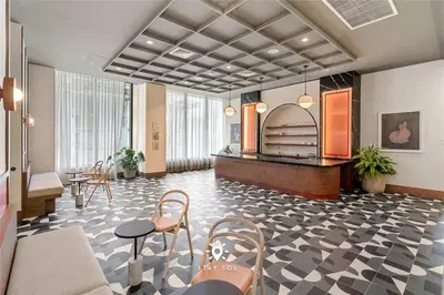 a lobby with a waiting area with chairs and tables at Stylish City Retreat With Private Balcony in Miami