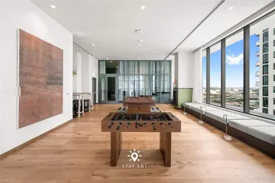 a room with two tables in a building with windows at Stylish City Retreat With Private Balcony in Miami