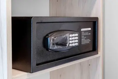 a microwave oven sitting on a wooden shelf at Downtown Edit-Resort Style Stay with Full Amenities in Miami