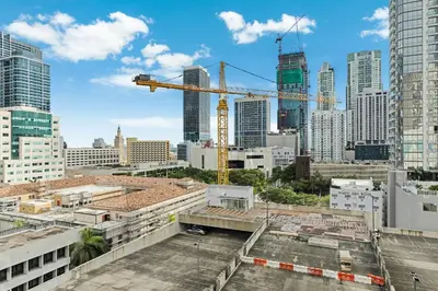 a view of a city skyline with a crane at Downtown Edit-Resort Style Stay with Full Amenities in Miami