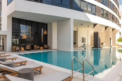a swimming pool in a building with a building at Downtown Edit-Resort Style Stay with Full Amenities in Miami