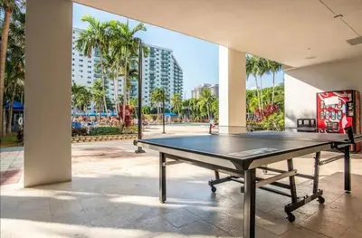 a ping pong table in a room with a building at Dream Beach Room Free Parking - 02227 in Sunny Isles Beach