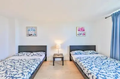 two beds sitting next to each other in a room at Coastal Elegance Oasis in Sunny Isles STR-01308 in Sunny Isles Beach