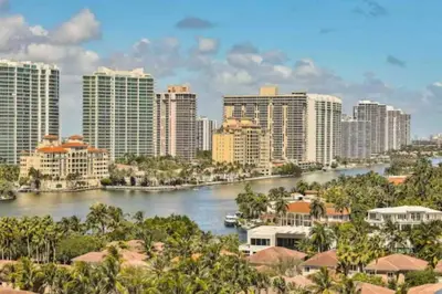 a view of a city with a river and buildings at Condo with Stunning View STR-01307 in Sunny Isles Beach