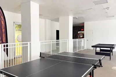 a ping pong table in a room with a ping pong ball at Condo on the Beach-STR 01309 in Sunny Isles Beach