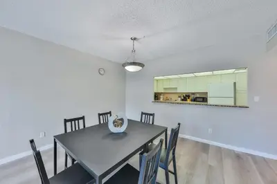a dining room with a table and chairs at Ocean reserve 1st floor across the beach STR-02382 in Sunny Isles Beach