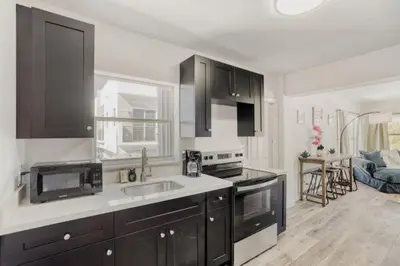 a kitchen with a sink and a counter top at Lauderdale Breeze Villas - Coastal 2 Bedroom in Fort Lauderdale