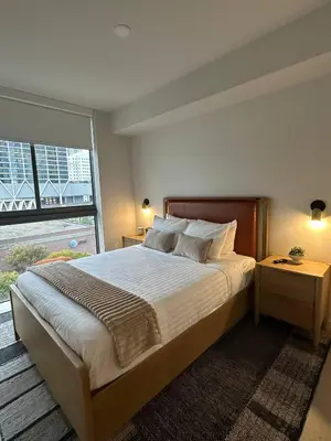 a bedroom with a large bed and a large window at Sophisticated 2BR2BA at Miami World Center in Miami