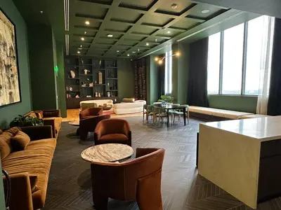 a lobby with couches and a table and chairs at Sophisticated 2BR2BA at Miami World Center in Miami
