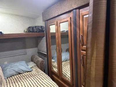 a bedroom with a cabinet and a bed in it at Getsemany Inc RV Dreams Hollywood in Hollywood
