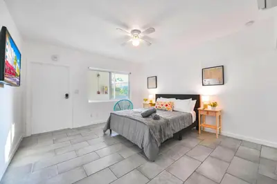 a bedroom with a bed and a ceiling fan at Relaxing Studio with Modern Comfort in Miami