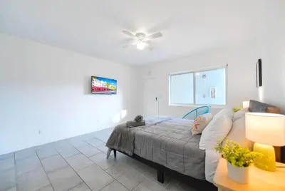 a bedroom with a bed and a ceiling fan at Relaxing Studio with Modern Comfort in Miami
