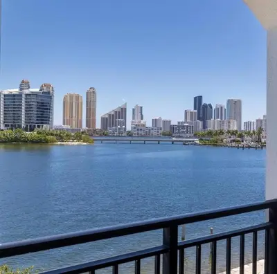 a view of a river with a city in the background at Serene Waterfront Condo - Bayview, pool & tennis in Aventura