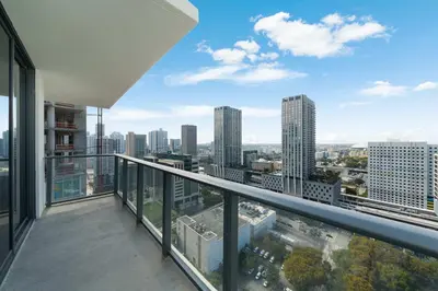 an apartment balcony with a view of a city at Downtown Drift-Luxury Amenities Sauna & Pool in Miami