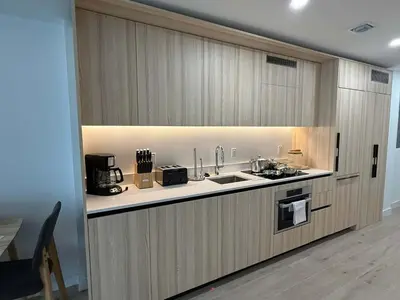 a kitchen with a sink and a counter at Downtown Miami 1BR Walk to Bayside Kaseya Gym Pool in Miami