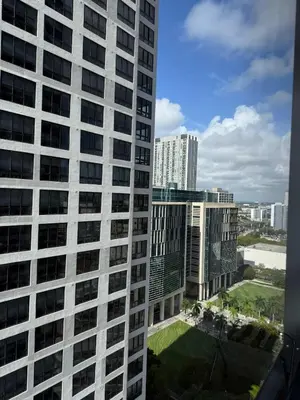 a view of a tall building in a city at Downtown Miami 1BR Walk to Bayside Kaseya Gym Pool in Miami