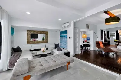 a living room with a couch and a table at Villa 800 - 3 BEDROOM - 3 AND A HALF BATHROOMS -6 BEDS- Spa like Retreat Saline Pool & Jacuzzi in Miami