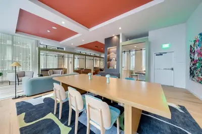 an office with a large wooden table and chairs at Miami Highline- Sauna Heated Pool Cabanas in Miami