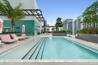 a swimming pool on the roof of a building at Miami Highline- Sauna Heated Pool Cabanas in Miami
