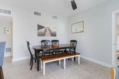 a dining room with a table and chairs at Shady Banks Oasis in Fort Lauderdale