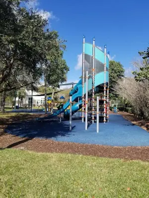 a playground with a slide in a park at Shady Banks Oasis in Fort Lauderdale