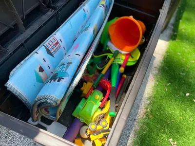 a drawer filled with toys and a toy train and umbrellas at Shady Banks Oasis in Fort Lauderdale