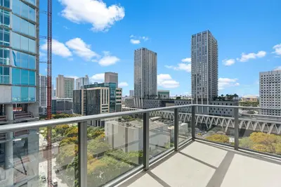 a view of the city from the balcony of a building at Downtown Stay with Rooftop Pool Amenities in Miami