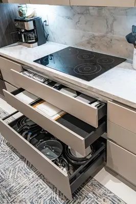 a kitchen with an open drawers with a stove at Casa Monstera Heated Saltwater Pool Game Room Golf in Fort Lauderdale