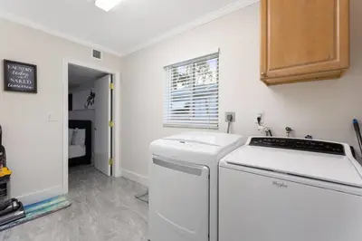a kitchen with a dishwasher and a sink at Private Oasis with Heated Saltwater Pool Tropical Backyard in Dania Beach