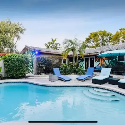 Private Oasis with Heated Saltwater Pool Tropical Backyard