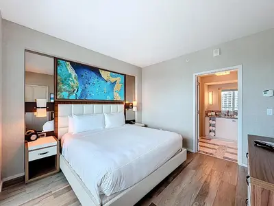 a bedroom with a large white bed in a room at Fort Lauderdale Beach Luxury - Ocean View Condo in Fort Lauderdale