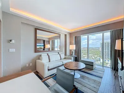 a living room with a couch and a table at Fort Lauderdale Beach Luxury - Ocean View Condo in Fort Lauderdale