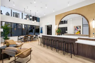 a bar in a restaurant with chairs and tables at Modern Downtown Miami Condo w Pool and Gym in Miami
