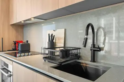 a kitchen with a sink and a faucet at Premium High-Rise Living at 501 First - Downtown Miami in Miami